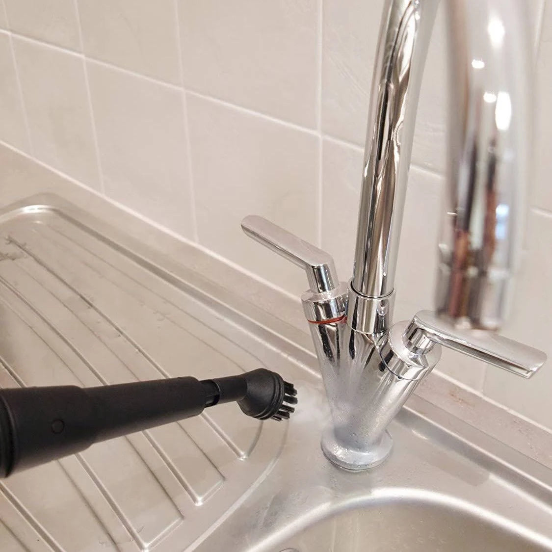 Using a steam cleaner to clean bathroom fixtures and faucets