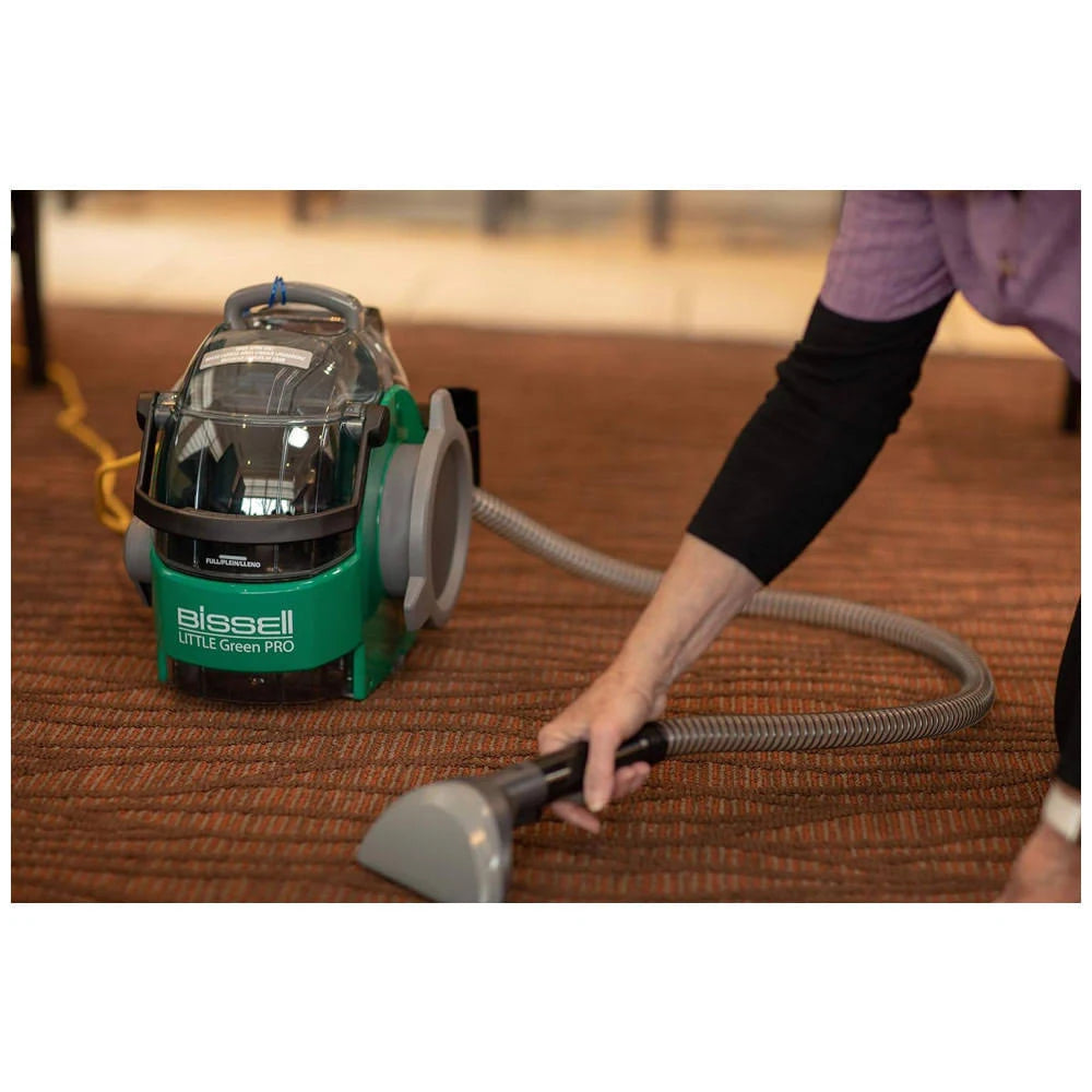 Using a Bissell spot cleaner to remove stains from carpet