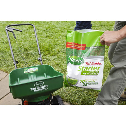 Applying Scotts starter fertilizer to a lawn